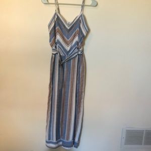 Jumpsuit with adjustable straps, built in belt an elastic waistband.